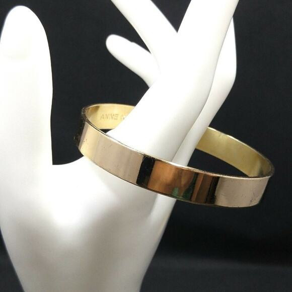 Anne Klein Solid Gold Tone Bangle Bracelet, 7 3/4 Inches, Very Reflective - Picture 2 of 8